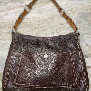 Medium size pebble leather coach purse.